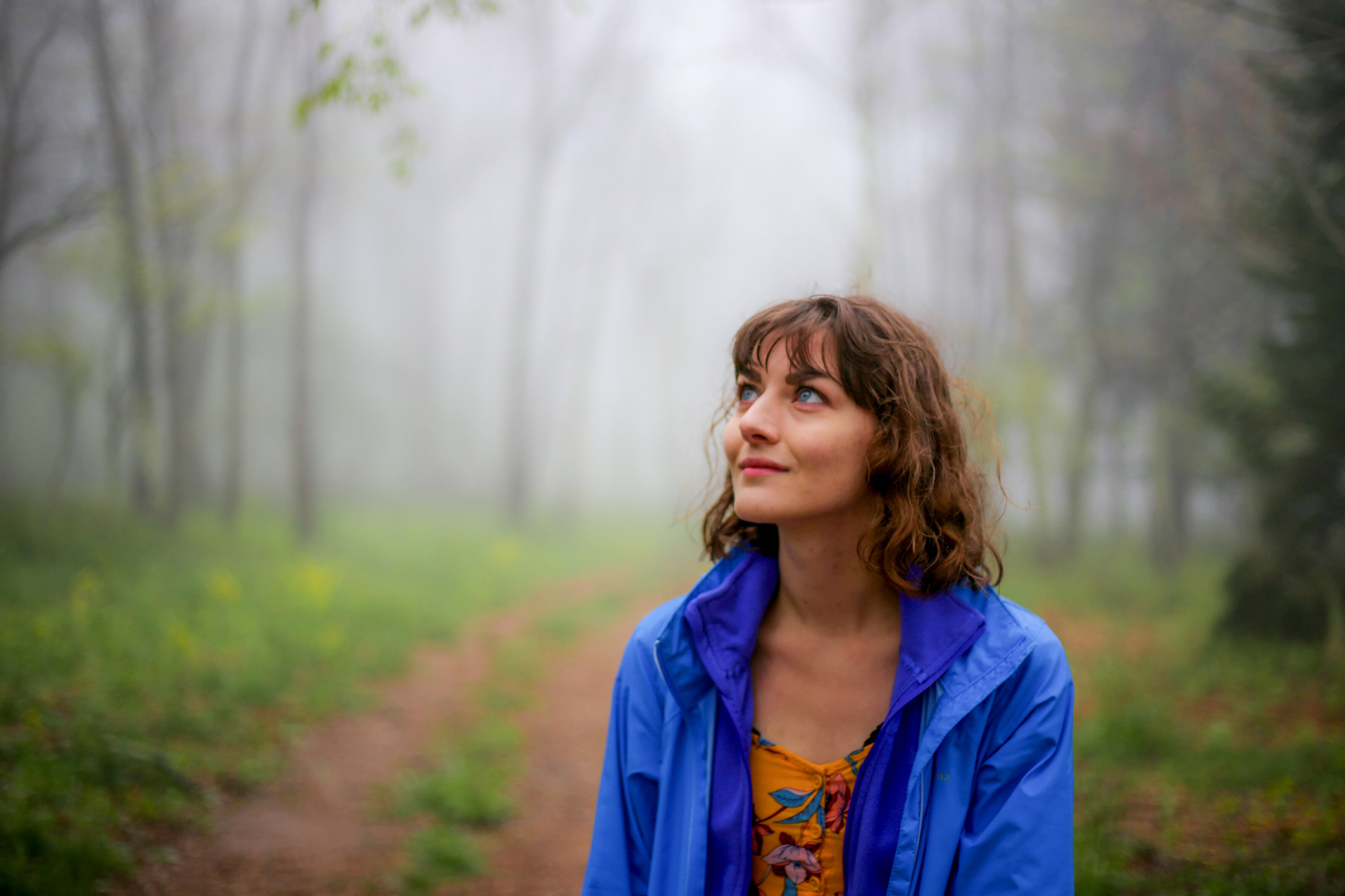 Alysa Segovia, Virginia elopement photographer, in a misty forest
