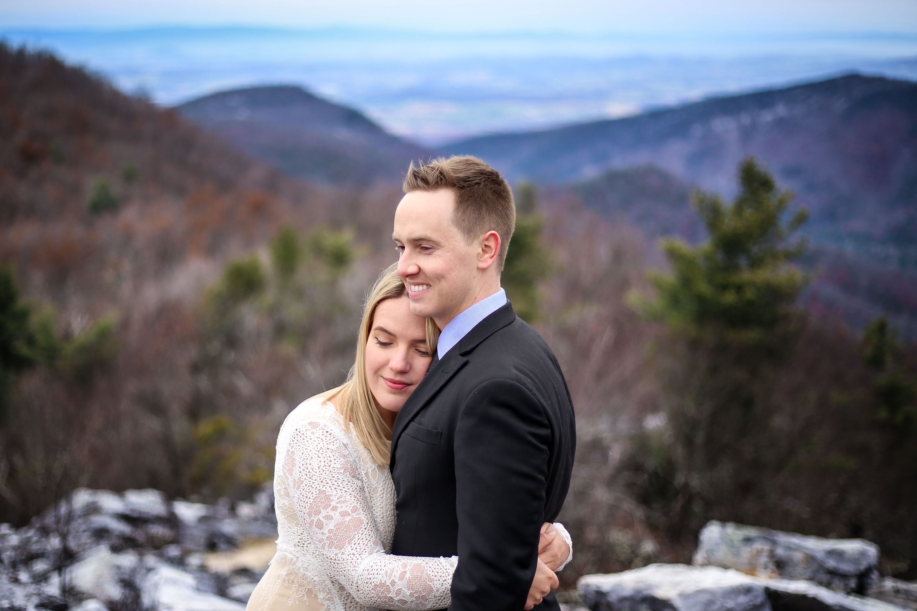 Couple embracing at Blackrock Summit in winter, Shenandoah National Park